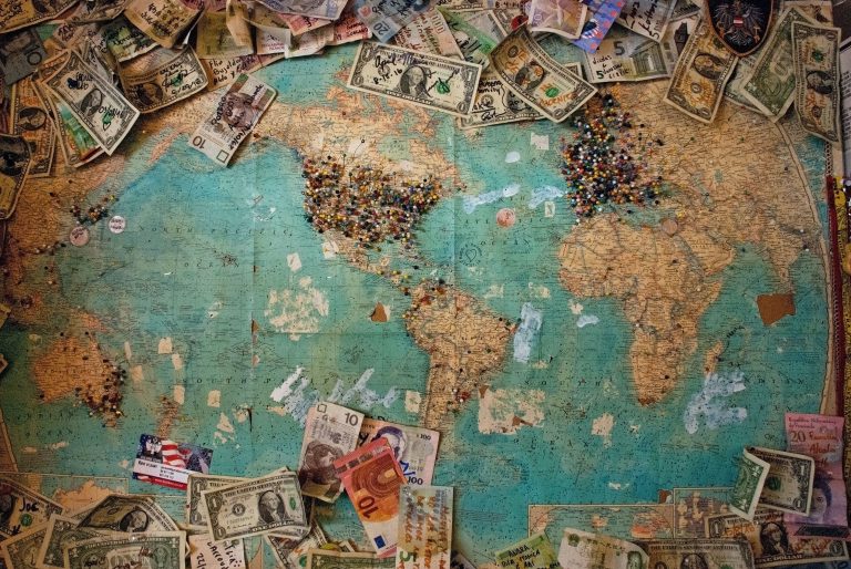 a picture of a map and dollar bills